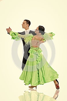 Ballroom dance couple in a dance pose  on white background. ballroom sensual proffessional dancers dancing walz