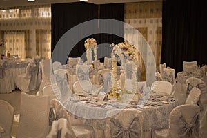 Ballroom with festive meals. restaurant arranged for the event