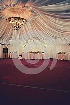 Ballroom with festive meals. restaurant arranged for the event