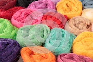 Balls of coiled natural wool for yarn, sewing, felting and making handmade crafts