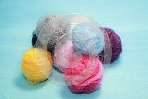 Balls of colored wool for making beads