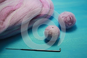 Balls of colored wool for making beads