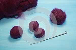 Balls of colored wool for making beads