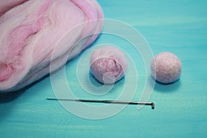 Balls of colored wool for making beads