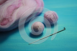 Balls of colored wool for making beads
