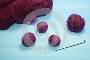 Balls of colored wool for making beads