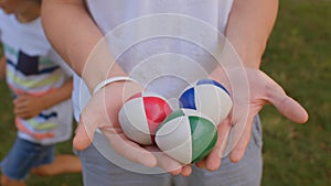Balls in the hands are prop used by jugglers. This three-pack of juggling balls