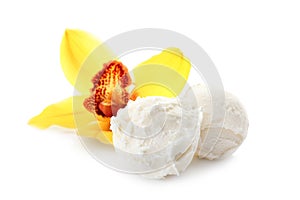 Balls of tasty vanilla ice cream and flower photo