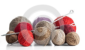 Balls of yarn in different colors with knitting needles.