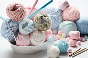 Balls of yarn in light pastel colors in knited backet. Skeins of yarn, needles and tools for needlework