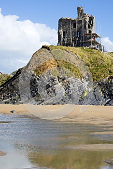 Ballybunion castle with scafolding on cliff photo