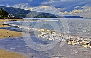 Ballygalley beach and shore line with Antrim Coast