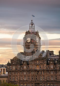 The Balmoral Hotel historical building in Edinburgh, Scotland, during a cloudy autumn morning.