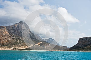 Balos beach with surrounding landscape, view from a ship at north-west coast of Crete island