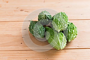 Balsam apple, Balsam pear, Bitter cucumber , Bitter gourd , Stuffed bitter gourd, karela on wood background