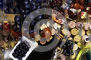 balsamic vinegar in a glass jug with fresh red grapes on wine corks background, rich with resveratrol, flavonoids, antioxidants,