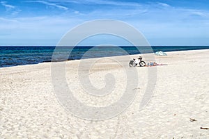Baltic coast landscape, Western Pomerania, Poland, Europe. Sunny summer day. Cyclists relax on the sandy beach