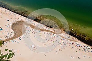 Baltic coast, people having bath in the sea and in the Oliwski stream mouth photo