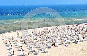 Baltic Sea beach tourists sunbeds umbrellas Travel background