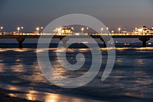 Baltic sea at beautiful sunset in Miedzyzdroje beach. Polish baltic coast. Famous city among the tourist. Pier at sunset