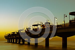 Baltic sea at beautiful sunset in Miedzyzdroje beach. Polish baltic coast. Famous city among the tourist. Pier at sunset