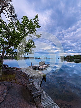 Baltic Sea coast with landing stage and boats near Oskarshamn in Sweden