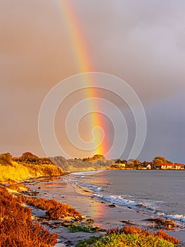 Baltic Sea coast with rainbow on the island Moen in Denmark