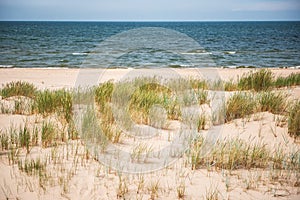 Baltic Sea and the dunes at Irbe river estuary photo