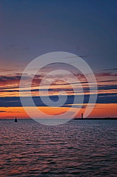 Baltic Sea with lighthouse in the evening in SwinemÃ¼nde. Swinoujscie, Poland