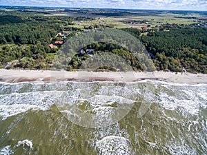 Baltic Sea in Lithuania. Karkle Town In Background photo