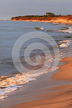 Baltic Sea shore line and beach in Rowy, Poland during sunset