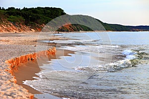 Baltic Sea shore line and beach in Rowy, Poland during sunset