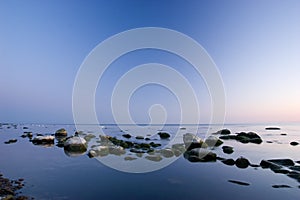 Baltic seaside with stones after sunset