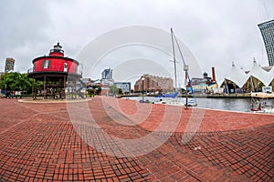 The Waterfront Promenade at the Inner Harbor with the Seven Foot Knoll Lighthouse, first lit