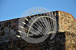 Balustrade at the castle in the autumn sun. the grille ending the end of the wall was protected from inappropriate intruders by th