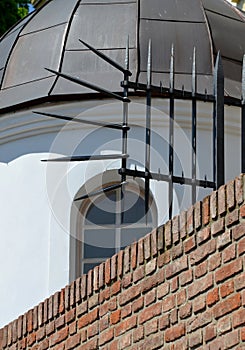 Balustrade at the castle in the autumn sun. the grille ending the end of the wall was protected from inappropriate intruders by th