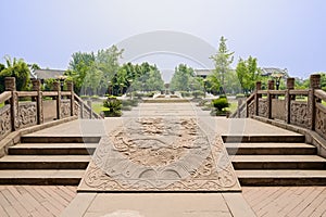 Balustraded stone bridge embossed with dragon designs in sunny s