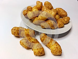 Bamba snacks on a white plate isolated on a white background. photo