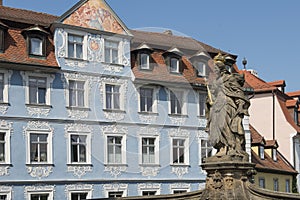 Statue of Queen Kunigunda before the Alte Rathaus bridge in Bamberg on a sunny day