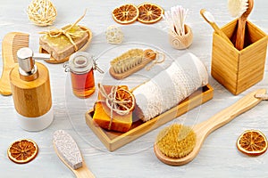 Bamboo acessories for bath - bowl, soap dispenser, brushes, tooth brush, towel and organic dry shampoo for personal hygiene