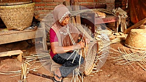 Bamboo basket craftswoman while doing his work