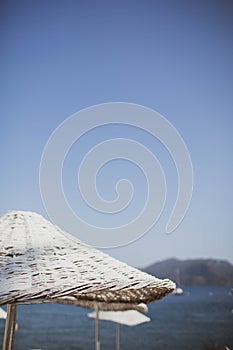 Bamboo beach umbrella on the background of the sea, beach.