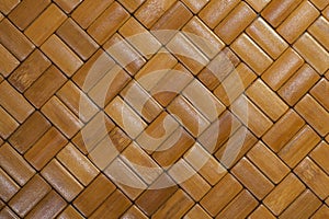 Bamboo brick mat texture. Brown tone bamboo placemat with a bricklike surface. Seamless wood pattern