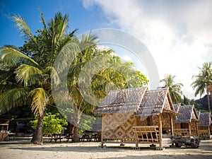 Bamboo bungalow resort with coconut tree background in Island.