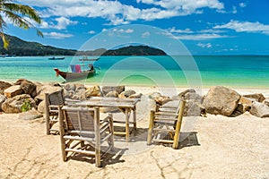 Bamboo chair on the beachblue sea and sky background