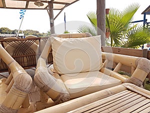 Bamboo chair table in summer day by the beach photo