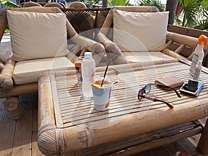 Bamboo chair table in summer day by the beach photo