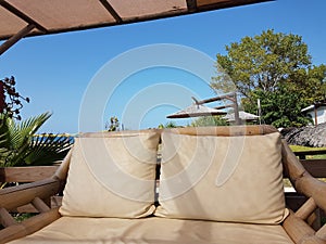 Bamboo chair table in summer day by the beach photo