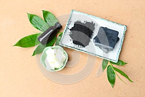 Bamboo charcoal glycerin soap set on brown background photo