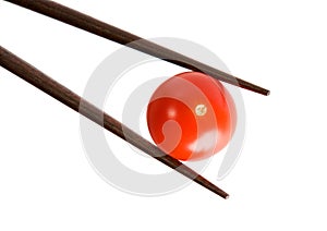 Bamboo chopsticks and cherry tomato